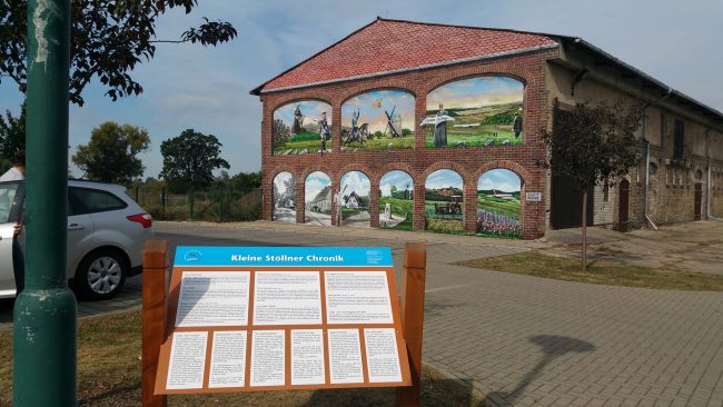 Fassadenkunst – Vom Schandfleck zur Leinwand – die Geschichte Stöllns an einer Fassade 2 fassadenkunst
